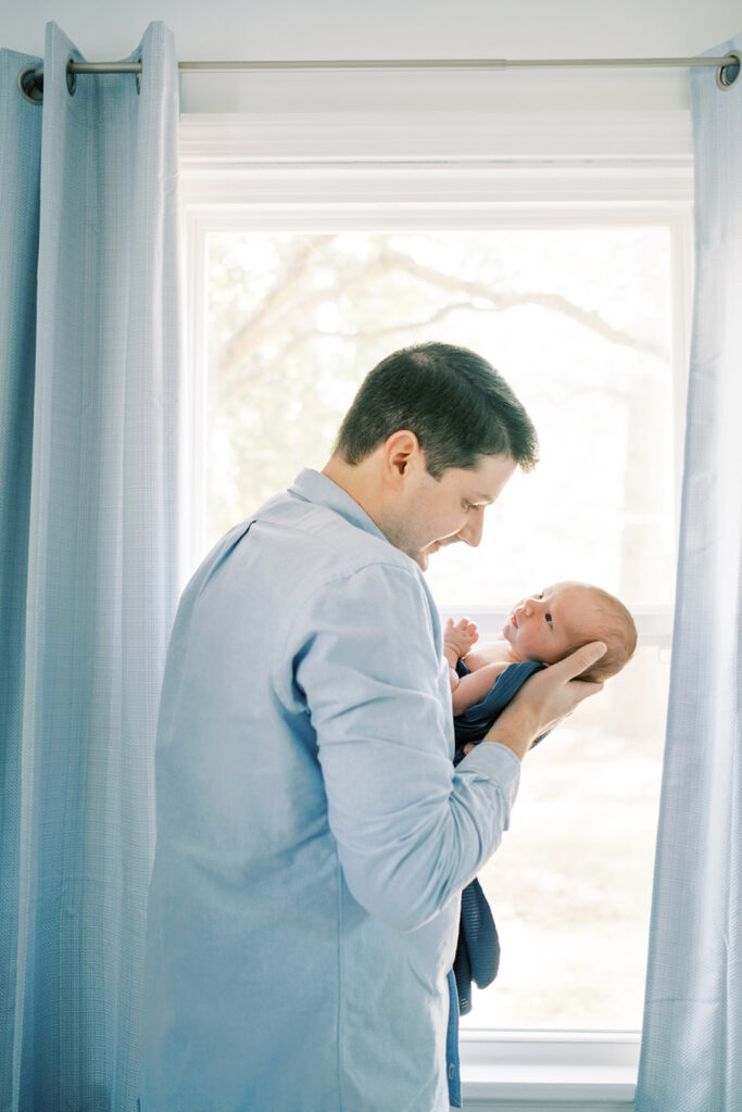 Dad and his newborn by a Richmond Newborn Photographer